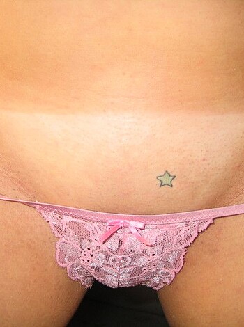 Vulgar description: A pair of pink panties with an unmistakable crotch bulge is clearly visible in this picture.