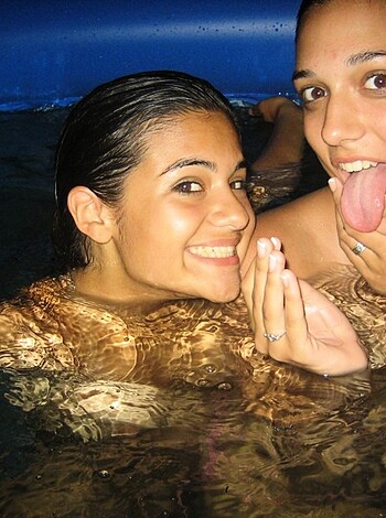 Three bitches in a pool taking a fucking selfie with their tongues out.