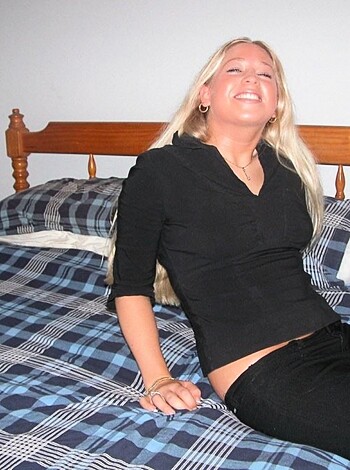 Blonde long-haired teen showing shaved pussy on bed - Photo 4