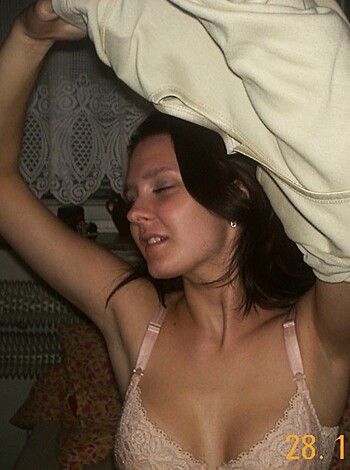 A chick with a brassiere covering her tits, sporting some cotton to protect from the sun's rays.