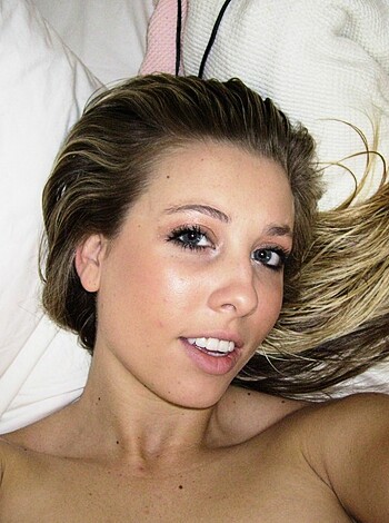 A naked broad is stretched out on her back with her mane splayed, and her fucking legs are crossed.