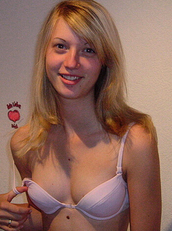 "Check out this bitch in her matching pink panties and bra. She ain't shy about showing off her rack."