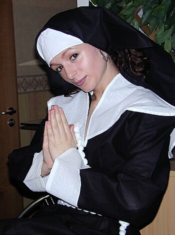 "Hey there! Check out this hot ass nun bitch, sucking on her fingers like a fuckin' amateur while she prays to goddamn Jesus Christ for some sweet ass forgiveness."