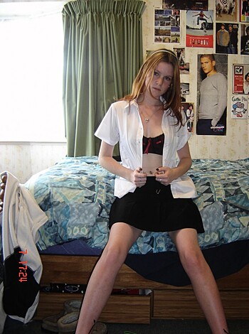 A chick in a short skirt and tight top, flashing her panties.