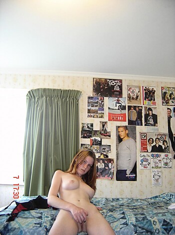 """
Fucking hot chick with massive tits fucking herself on a goddamn bed.
"""