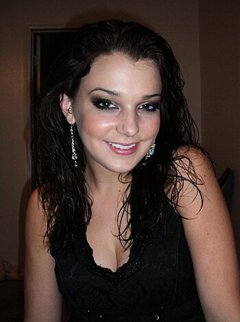 Vulgar description: Fucking hot chick with black dress and bitchin' ass earrings.