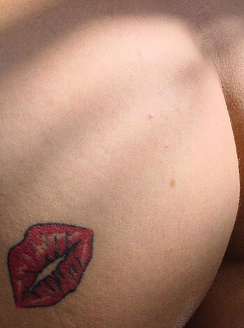 "Here's a huge fucking tattoo of a mouth with luscious red lipsticked lips, bitches!"