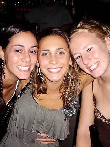 Vulgar description: "Here's a fuckin pic of some drunk bitches at a bar, grinnin like retarded monkeys and shitfaced as hell."
