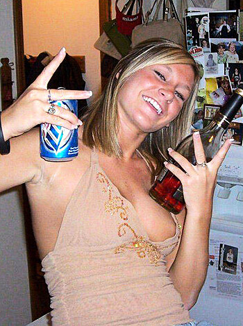 Here's the vulgar, factual description of this image. The perky bitch with her tits and ass out, flaunting her fingers like a fucking slut.