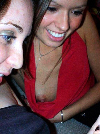 A couple of hoes, both with big tits and red shirts, texting while checking out some fuckable tit action.