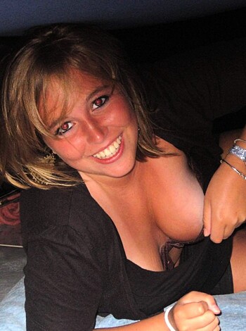 This dumb bitch is posing for some fucking camera while sitting on her shitty boat. She looks like a goddamn lobster with all those red fucking freckles covering her face, and she's probably got a goddamn yeast infection from all that ass-fucking she does with her stupid husband. Look at her stupid fucking smile - I bet she smells like fish and piss, and her shirt is all sweaty and stained because she's too damn lazy to do any goddamn laundry. Fuck this bitch.
