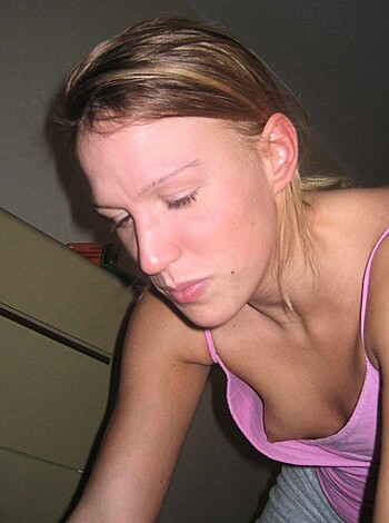 This image shows a chick's titties cause she ain't wearin no brassiere, yo.