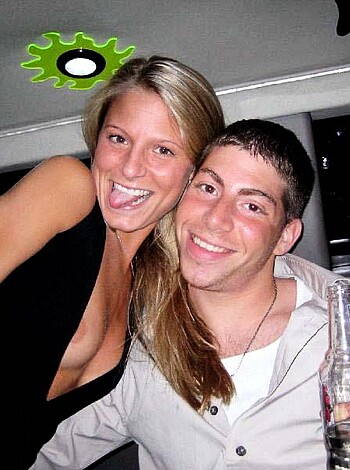Here's the vulgar description of the image:
A hot, sexy babe in a tight-assed black top is exposing her tits and ass to the camera.