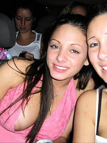 Two chicks grinding in a car, sucking face and shit.