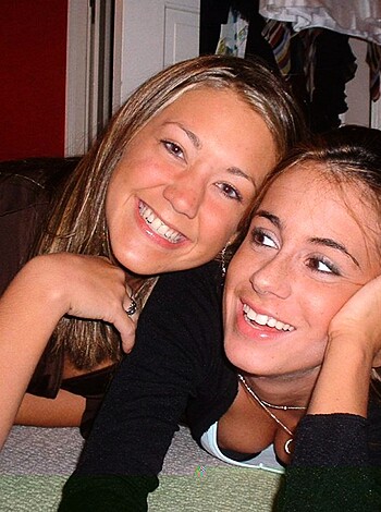 "A couple of chicks getting cozy, smiling ear to ear."