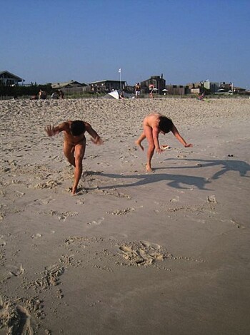 Fuckin hot babe and dude gettin their asses off while runnin nude on the goddamn beach, lookin like they're havin a blast, showin off them tits and dick for all to see, not givin a fuck who watches.