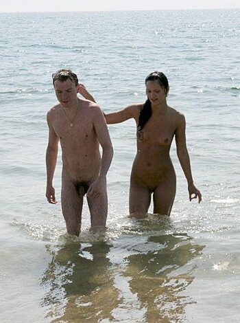 The guy's lifting up the naked chick from the pool after they banged.