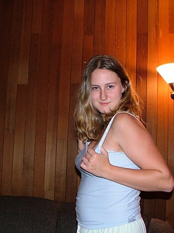 "Tits-out chick at her crib."