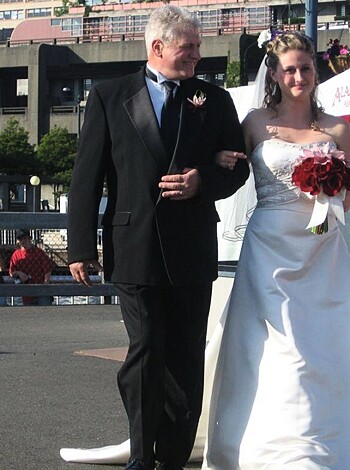"Hey, check this shit out bro - it's an old fart and an even older bitch, probably getting hitched on some beach in their finery. Probably got rings too, probably gonna get fucked real good after this shindig."