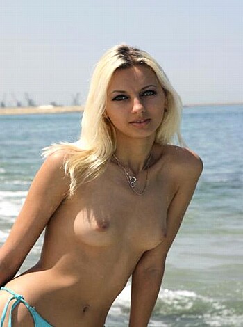"A fuckin hot bitch with tits out, chillin at the shore."