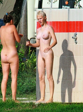 Four busty chicks in the showers, getting wet and wild,
Their pussies all exposed, tongues down each others spills.