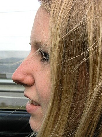 A bitch's dome peeking outta a whip's winda.