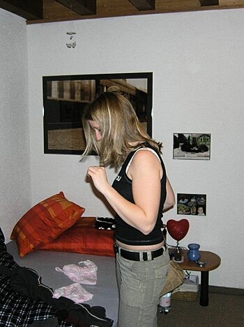 "Here's a picture of some hot chick with her finger up her snatch, trying on a new pair of thongs."