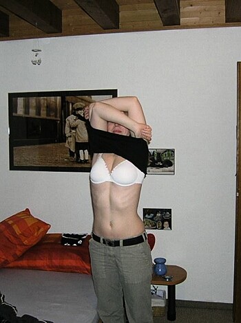 The image shows a dumbass male with his brassieres, undergarments and not a single shirt, fucktard!