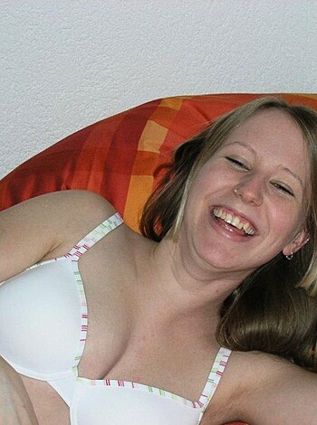 """
Hottie flashing her tits and screaming with joy.
"""