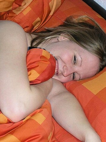 Vulgar Description: This image of some bitch smiling while she sleeps, with her dumb eyes closed like a fucking dummy is giving me an unlimited amount of reasons to punch her in the face. Don't you dare judge me if I do that. And no, I don't care how vulnerable this picture makes her look.