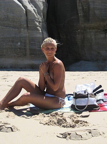 Vulgar description: Fuckin hot bitch titties out on the sandy beach, gettin some sunshine, showing off her tight ass and fuckable curves for all us horny dudes to gawk at and jerk off to.