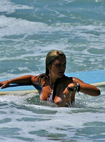 "F**king hot bitch on a piece of f**king wood trying to catch some waves."