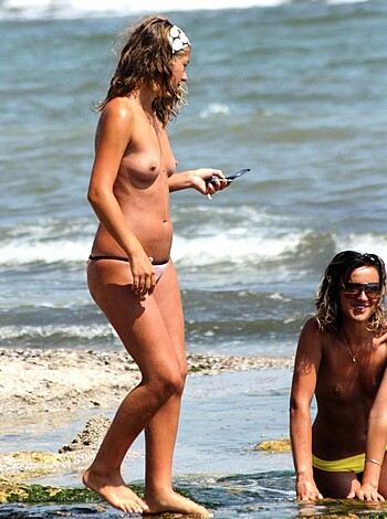 "Bitch walking on sandy shore with seashells, carrying her fucking iPhone like she owns it."