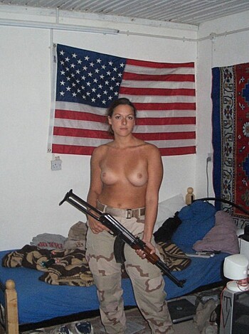 Here's a photo of a fucking hot bitch with a gun, pointing it directly at ya, motherfucker.