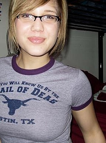 Here's a fuckin picture of some bitch wearin a goddamn gray shirt with that fucked up writing "Texas" on it in white letters like she gotta prove some shit to yall.