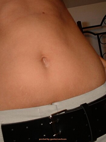 Here's a f***ing photo of a chick with her goddamn navel poking out from her shirt.