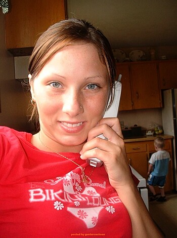 The bitch is on the fucking phone in the goddamn kitchen.