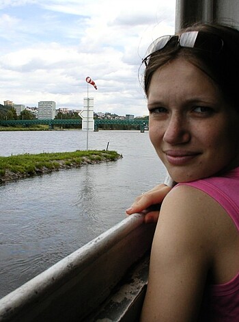 The bitch is looking over some fucking railing, probably thinking she's so goddamn beautiful or something when really she's just another asshole staring at the ocean like a total cunt.