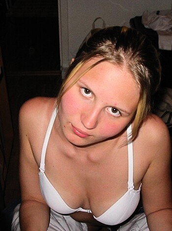 """
Here's some good old-fashioned ass-grabbing of a blonde chick wearing white lacey underwear while she sits on the couch with her legs spread wide open. This is definitely one for the dudes.