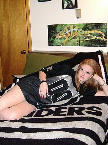 """
Hot babe in her panties, spreading her legs wide open on the bed.
"""