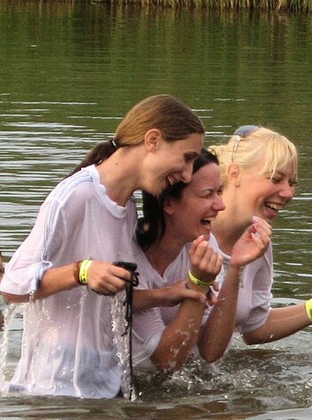 Look at these three dumb bitches wading their fat asses into the water like fucking retards, trying to be cute or whatever with that shit, like they even give a fuck about anything but themselves and their ugly faces, while they're standing there in the river like a bunch of fucking losers.