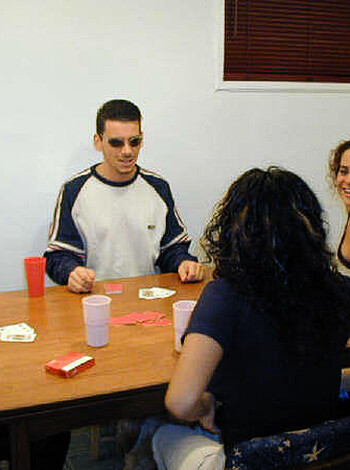 A fucking douche canoe is playing poker with some hot ass tits and cleavage, bro!