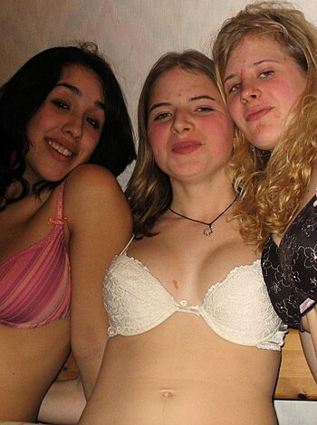 Vulgar description:
"Yo, check out these three fine-ass bitches in their sexy ass undies, all cuddled up tight like they're fuckin' best friends or some shit, smilin' for the camera like they got nothin' to hide. Damn, those titties look good in that lingerie too."