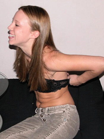 """
Here’s a fuckin picture of some hot ass bitch chillin on the sofa with her tits out and a smile on her face. You better cum and get your dick sucked you dirty fucker.