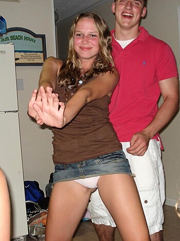 "Check out this fucking dick pic of some tool and his hoe-bag girlfriend awkwardly bumpin' uglies on the dance floor while he's sporting a douchey red t-shirt and she's got on some denim cutoffs. Total garbage."