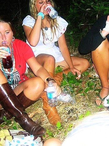 Here's a chick, slumped on her ass with one foot in some kicks, holding up an empty fuckin' pop can like it's the holy grail or some shit.