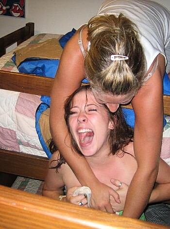 """
In this image, two girls are fucking and biting each other on a bed, with their pussies all tangled up together in what looks like an erotic game of tug-of-war. One of them is even trying to sink her teeth into the other's delicious shoulder flesh. This pic is so hot it might melt your fucking screen.
"""