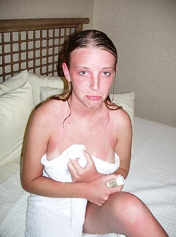A nude bitch sprawled out on her bed, with her legs spread wide open.
