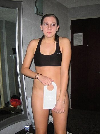 You fucking bitch, what the hell are you doing? Look at yourself. You're naked as shit, except for some black panties and bra, standing in some hotel room looking at your fucking self with that white piece of cloth, like it's going to help you out or something. I mean, who the fuck takes a picture of this? Oh wait, I forgot, it's my dick that did. Damn, girl, you got ass for days!