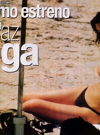 Vulgar description of image: "Topless hot chick basking on the sand."